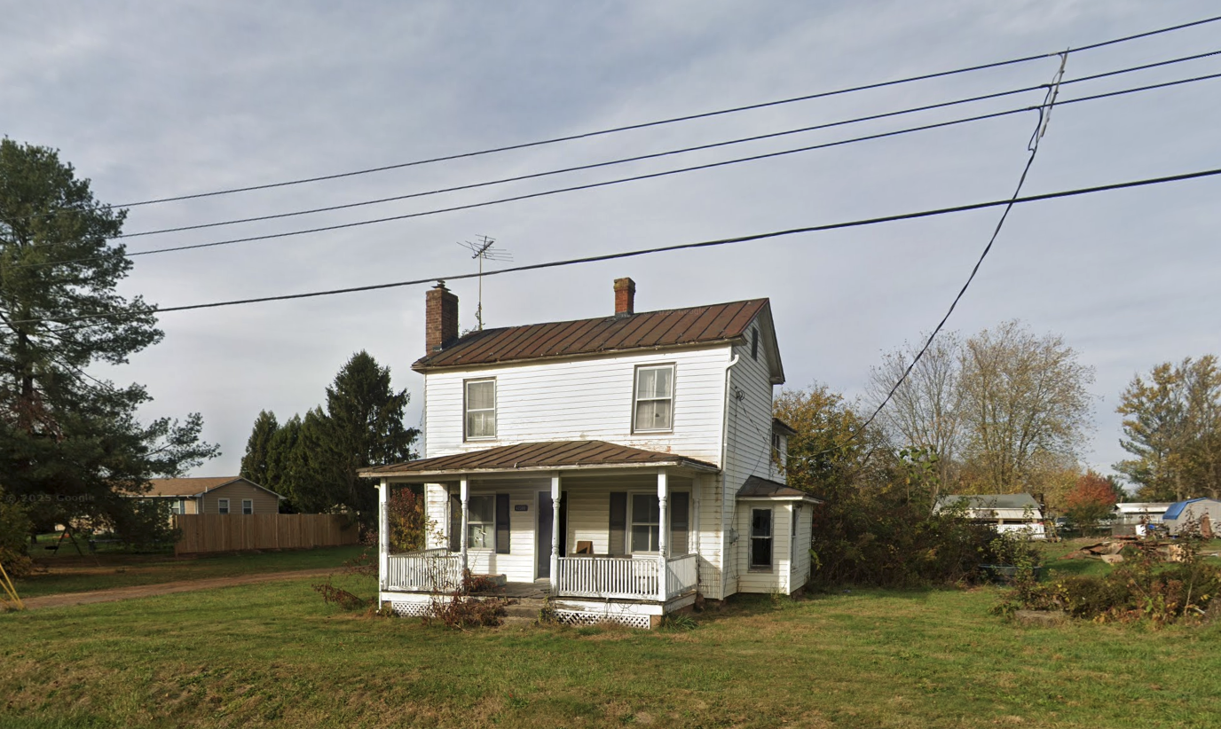 The historic white two-story Mullen House at 42388 Stumptown Road before demolition
